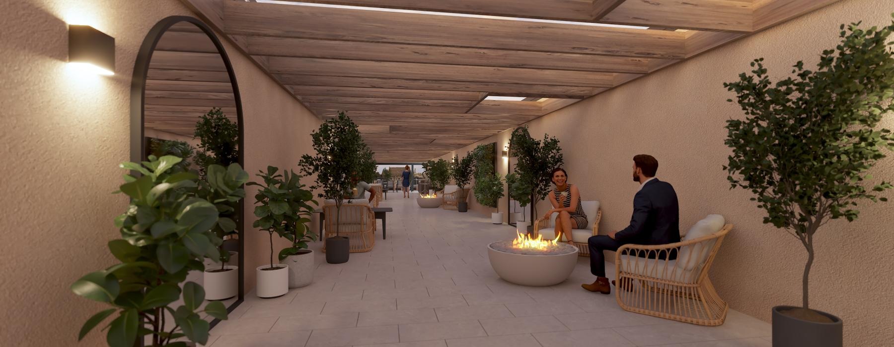 a man and woman sitting on a couch in a room with potted plants