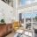 the living area with a chair and mirror